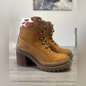 Steve Madden leather tan heeled boots with cow print.